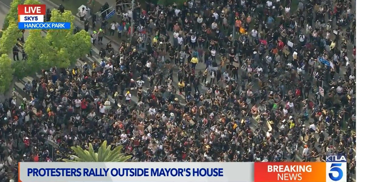 Thousands protested outside Los Angeles mayor’s house amid public outrage at LAPD during an emotional Zoom town hall