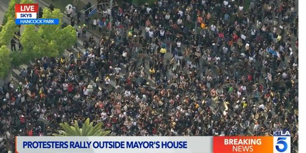 Thousands protested outside Los Angeles mayor’s house amid public outrage at LAPD during an emotional Zoom town hall