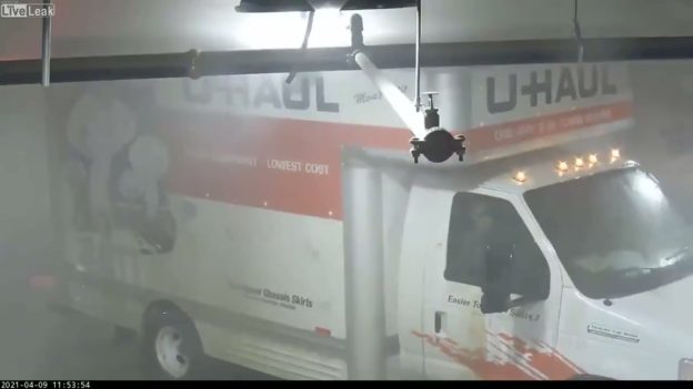 Absolutely incompetent people try to park a U-Haul in a parking garage