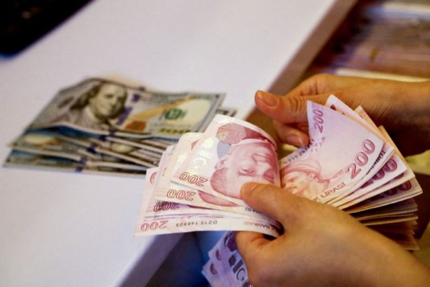 Turkish lira slides almost 8% after intervention-driven surge