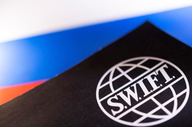 SWIFT says it preparing to comply with curbs on Russian banks