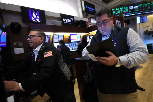 S&P 500 ends near flat but index posts biggest weekly gain of year