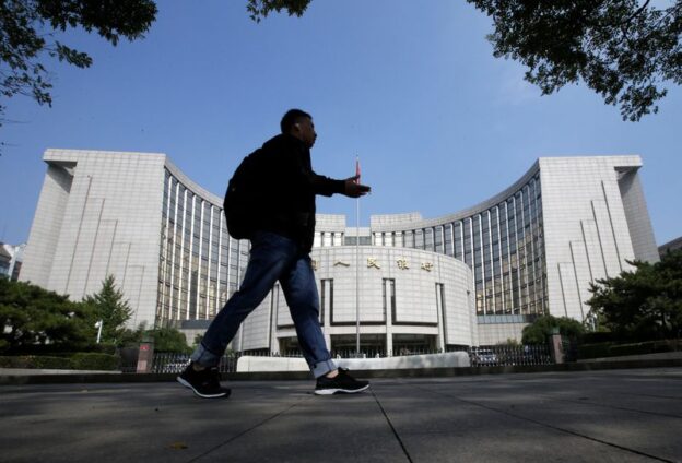 China central bank unexpectedly conducts medium-term loan operation, cuts interest rate