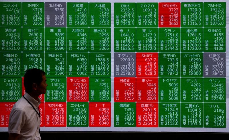 Stocks drop, bond yields rise; Fed keeps rates steady but projects hike for later this year